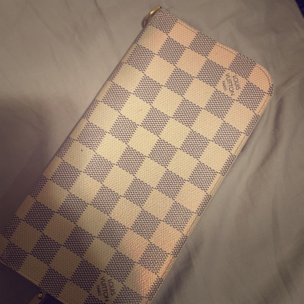 Louie Vuitton wallet zip up.